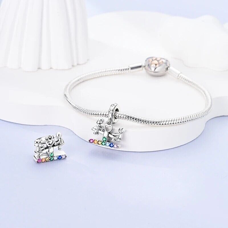 Boy With Girl on Swing and Zirconia Charm