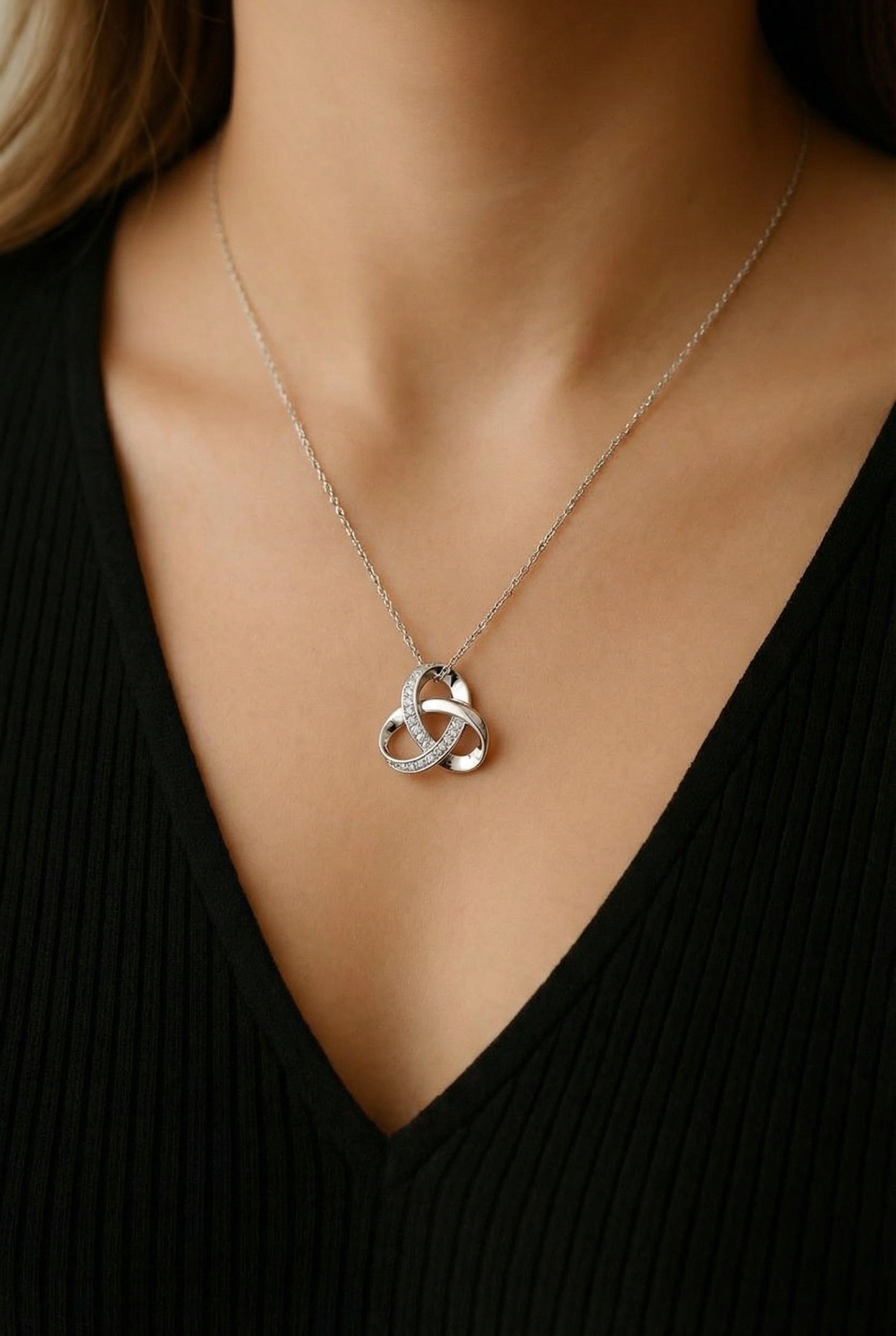 Silver Celtic inspired knot necklace with crystal accents on delicate chain