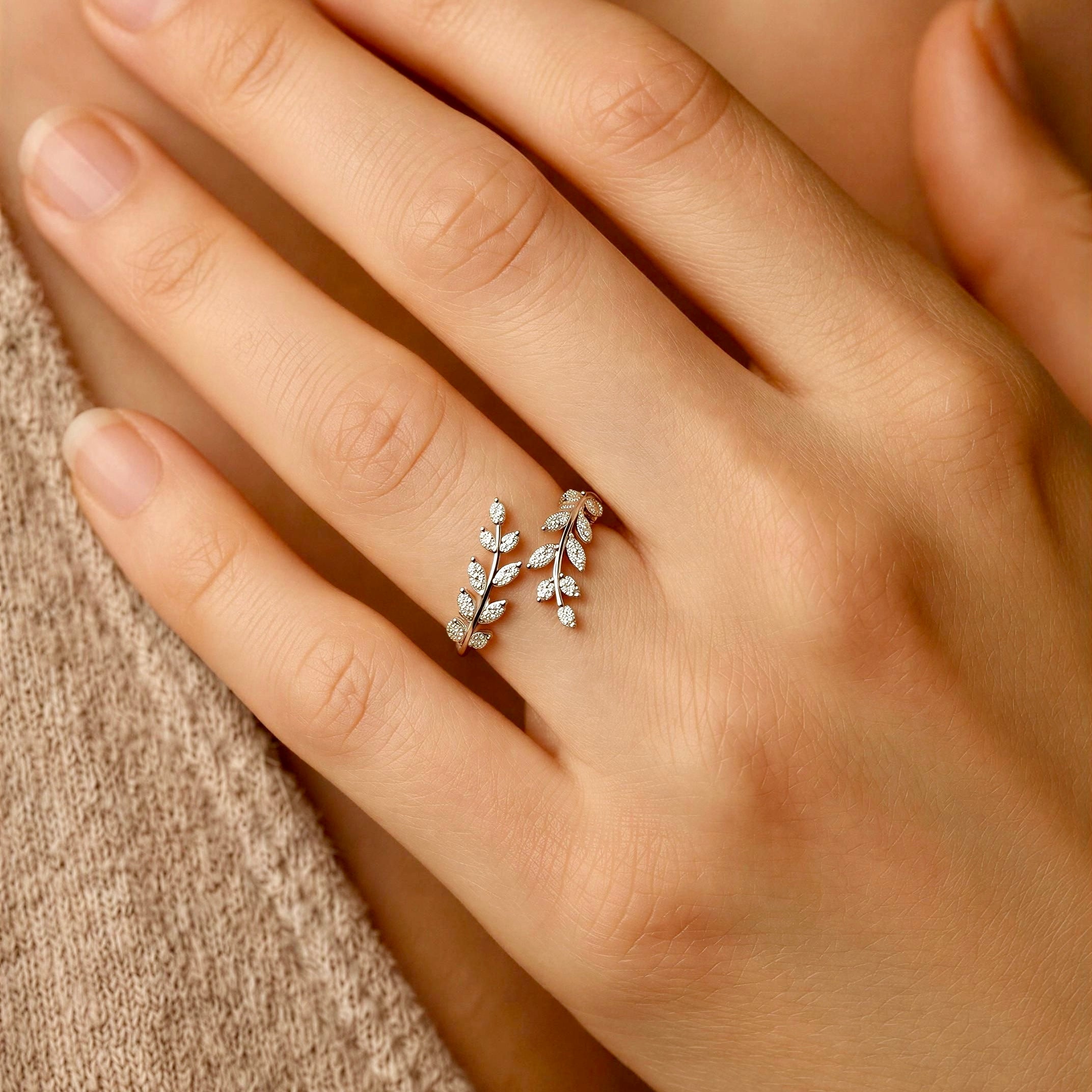 Silver adjustable vine ring with sparkling leaf details and open wrap design