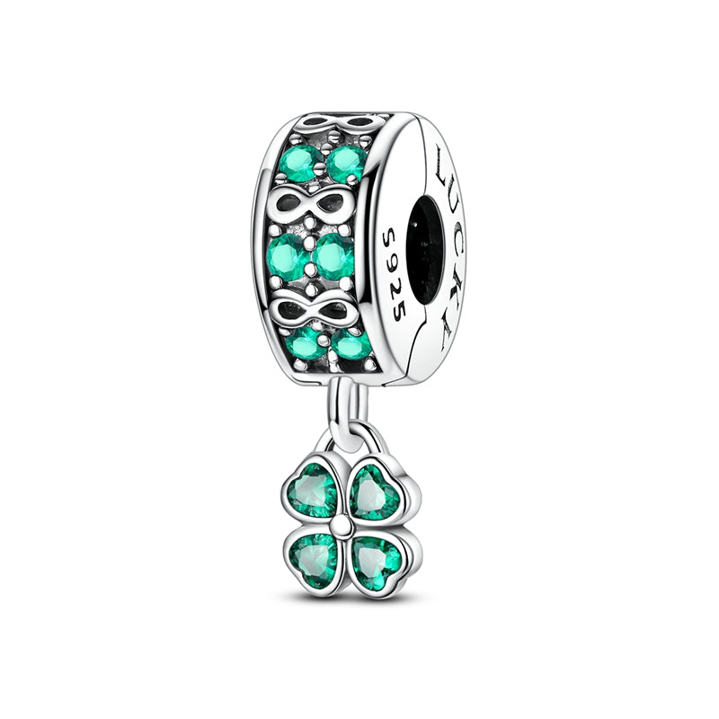 Silver clip-on charm with green crystals, infinity symbols and dangling four-leaf clover