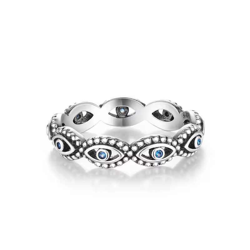 Sterling silver evil eye ring with blue crystal accents and beaded detailing
