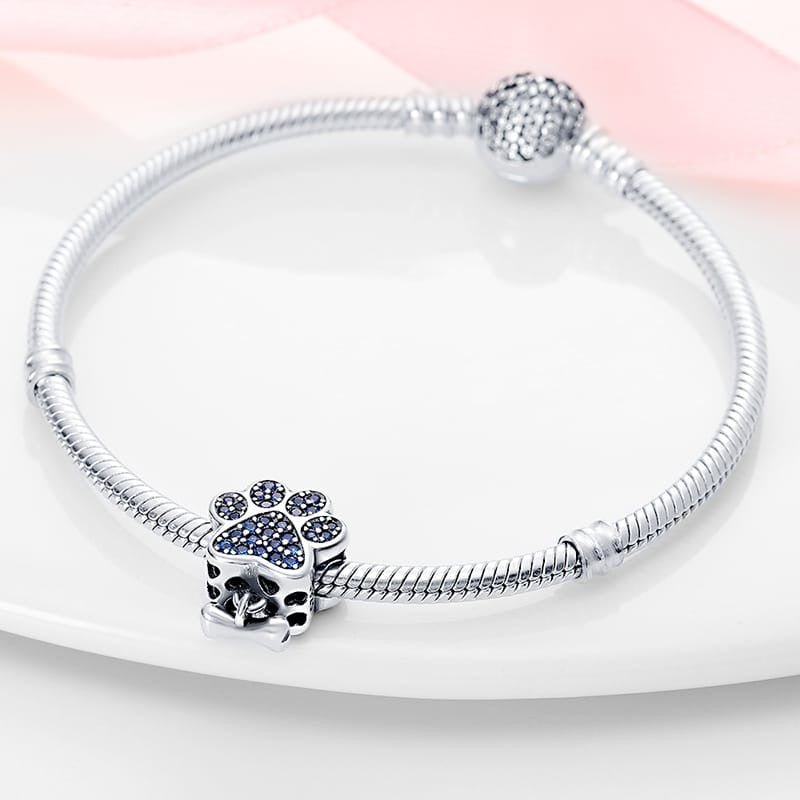 Paw Print Charm with Blue Cubic Zirconia and Bone Dangle - bellissi