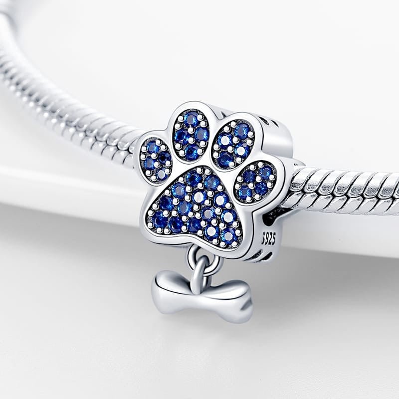 Paw Print Charm with Blue Cubic Zirconia and Bone Dangle - bellissi