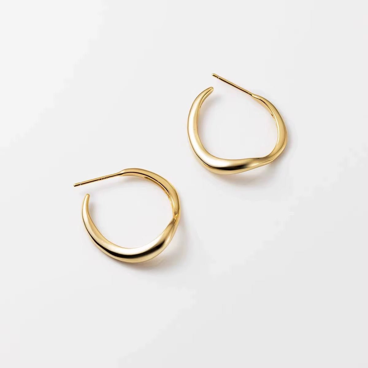 modern Waveform earrings — sleek silver curved earrings inspired by sound waves