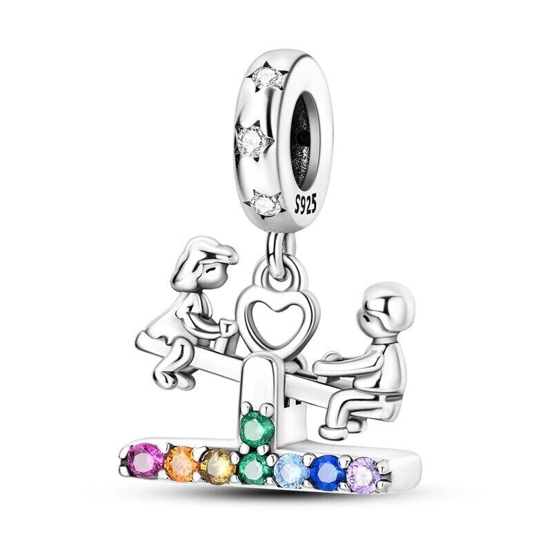 Boy With Girl on Swing and Zirconia Charm
