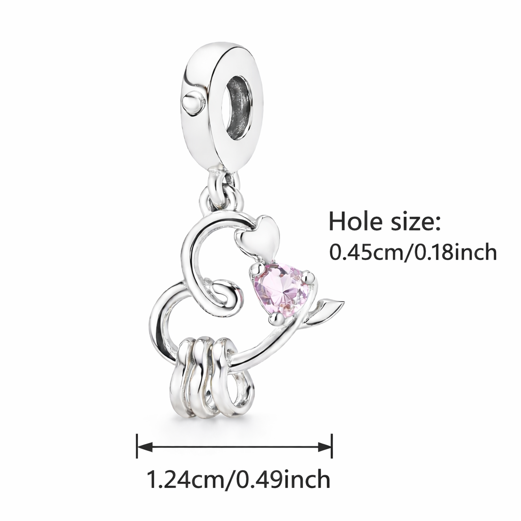Silver charm with pink gemstone and measurements on a white background