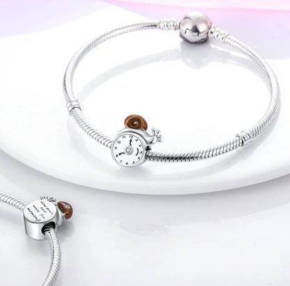 Snail on Clock With Zircon Charm
