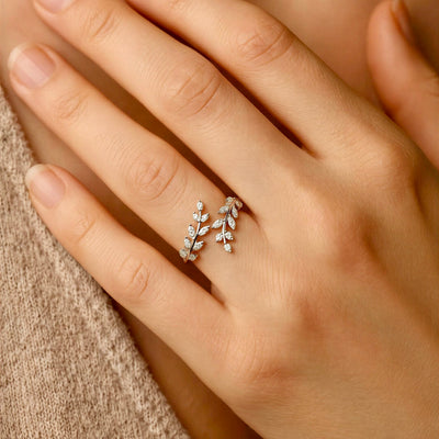 Silver adjustable vine ring with sparkling leaf details and open wrap design