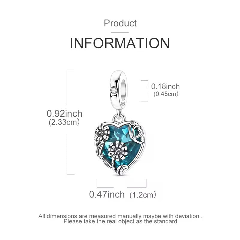 Heart-shaped pendant with blue gemstone and silver accents, shown with measurements on a white background.