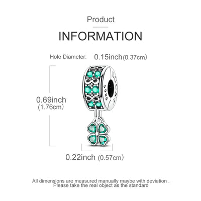 Silver clip-on charm with green crystals, infinity symbols and dangling four-leaf clover