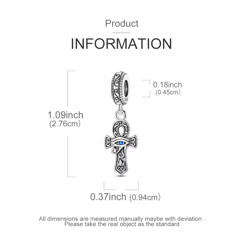 Product information diagram showing a silver-toned cross charm pendant with an evil eye detail, with dimensions labeled as 1.09 inches (2.