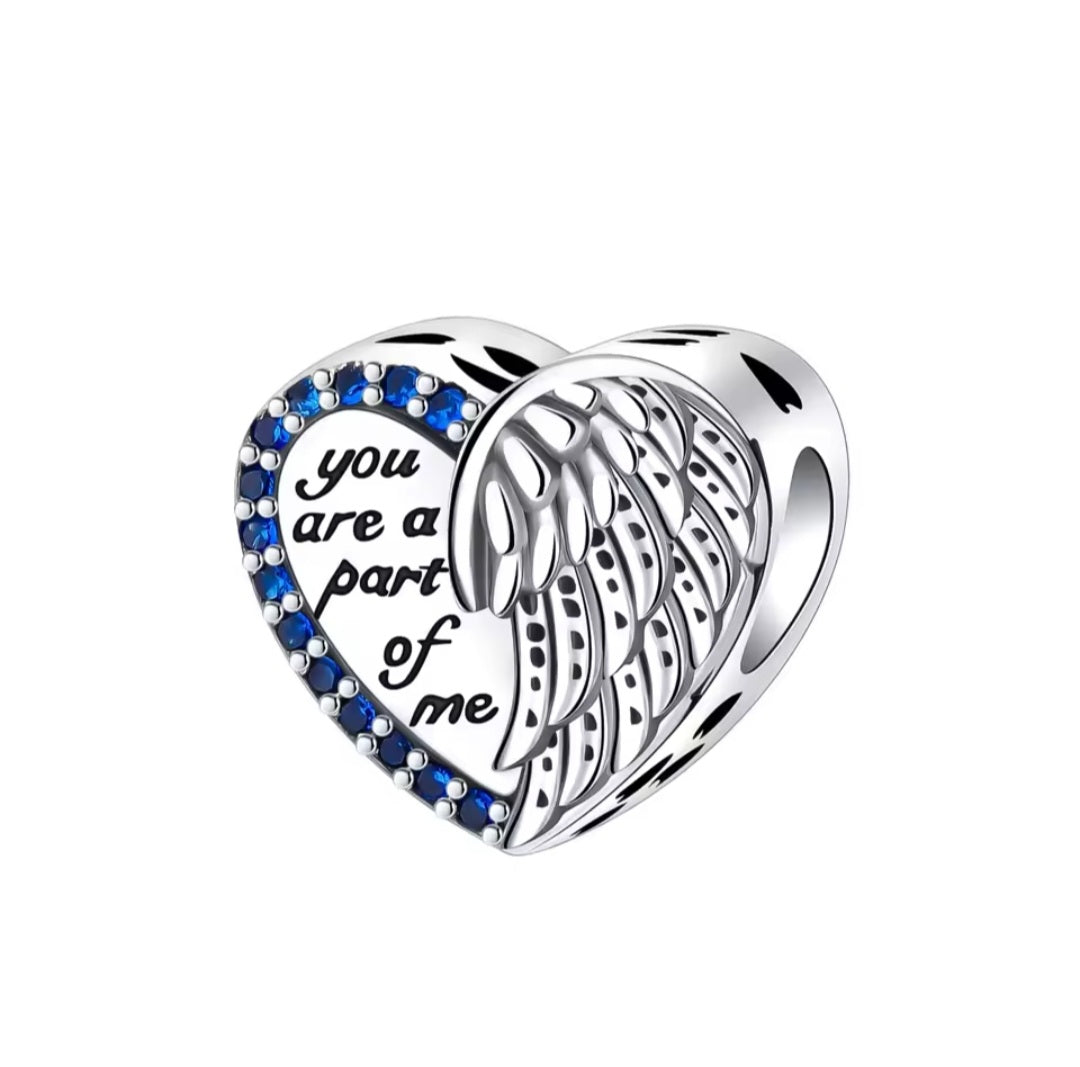 Heart charm with angel wings and blue crystals engraved “You are a part of me”