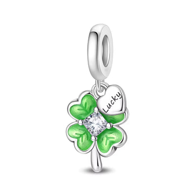 Silver lucky four leaf clover charm with green enamel leaves and crystal center