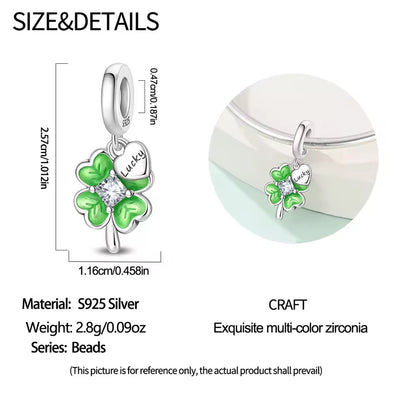 Silver lucky four leaf clover charm with green enamel leaves and crystal center