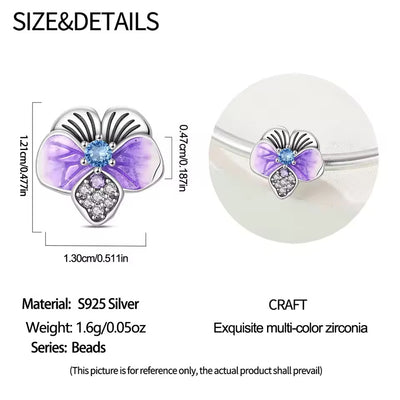 Silver butterfly charm with purple enamel wings and crystal details for charm bracelet