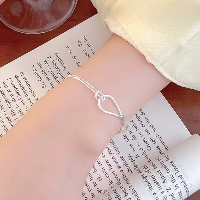 Infinity curve bracelet minimalist elegant jewelry for women simple modern wrist accessory everyday style
