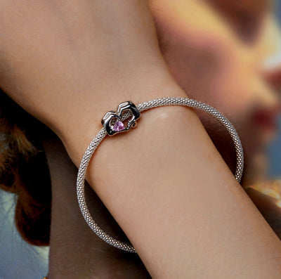 Silver charm with mother and child hands forming heart holding pink crystal bead for bracelet