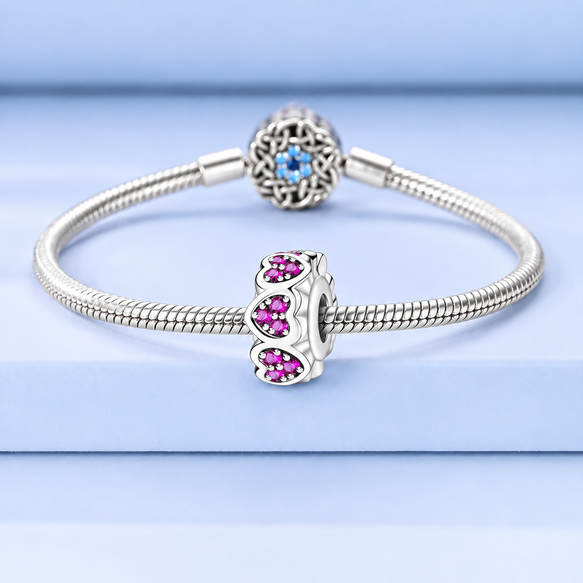 925 sterling silver heart charm with sparkling pink stones and open bead design