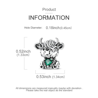 Silver Highland cow charm with emerald green heart crystal and detailed fur design
