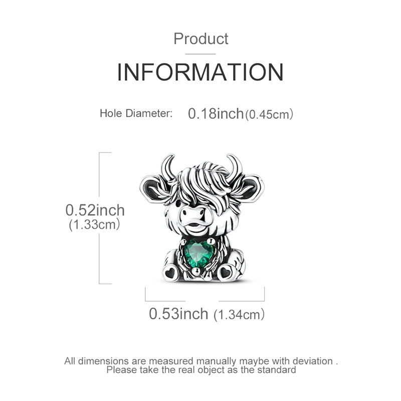 Silver Highland cow charm with emerald green heart crystal and detailed fur design