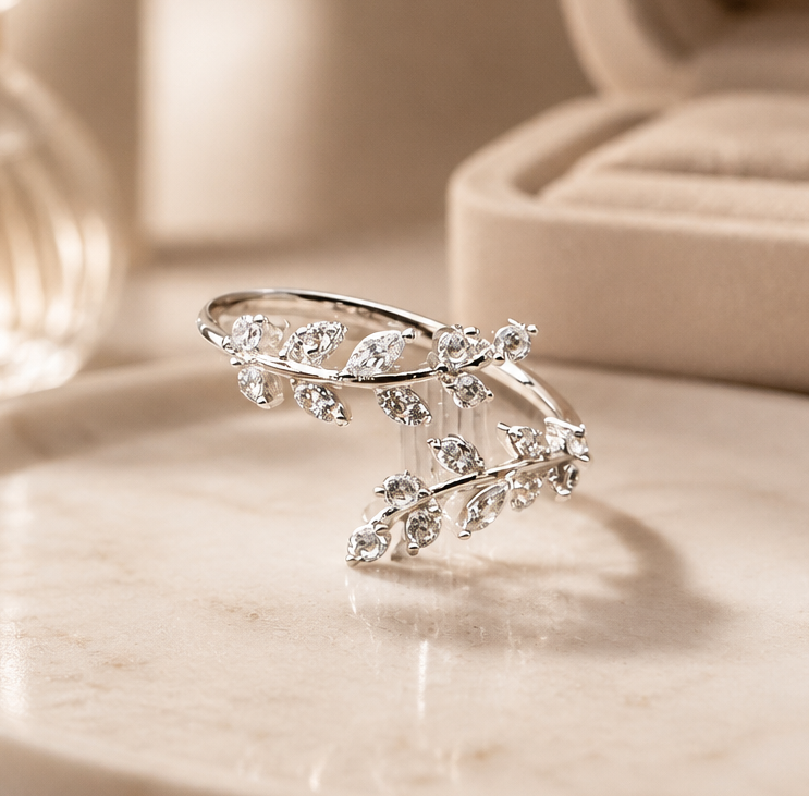 Silver adjustable vine ring with sparkling leaf details and open wrap design