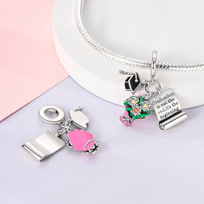 Silver graduation charm with cap, flowers, pink accents and engraved scroll pendant