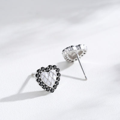 Silver heart stud earrings with black crystal border and white quilted center