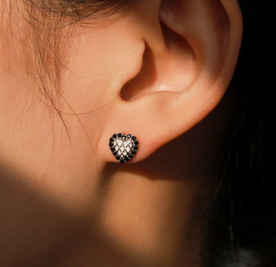 Silver heart stud earrings with black crystal border and white quilted center