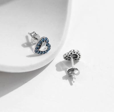 Silver heart stud earrings with turquoise stone detailing