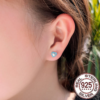 Silver heart stud earrings with turquoise stone detailing