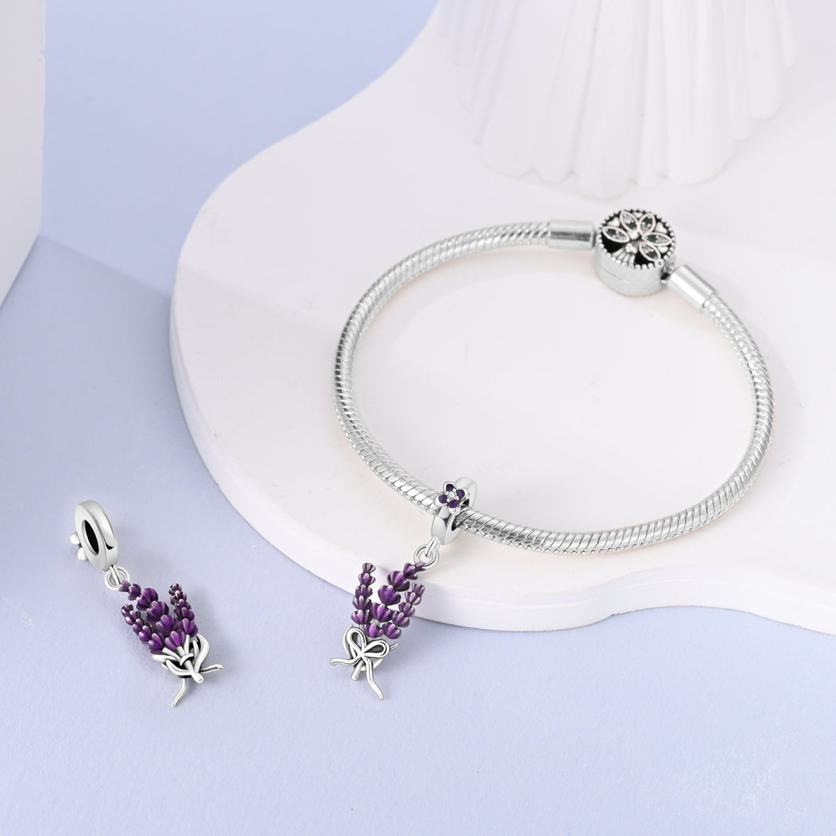 Sterling silver lavender flower dangle charm with purple enamel petals and crystal detail.