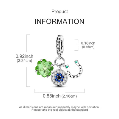 Sterling silver lucky charm with green crystal clover, evil eye pendant, and horseshoe detail