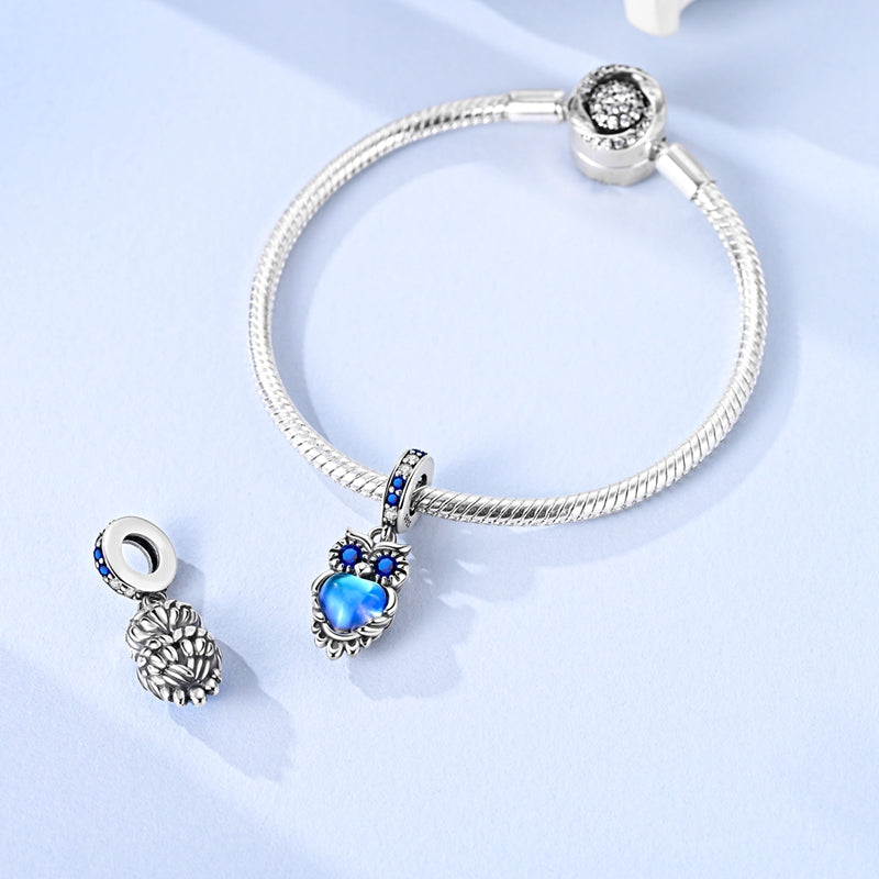 925 sterling silver owl charm with blue crystal eyes and glowing blue heart pendant