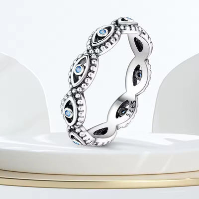 Sterling silver evil eye ring with blue crystal accents and beaded detailing