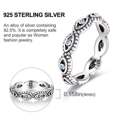 Sterling silver evil eye ring with blue crystal accents and beaded detailing