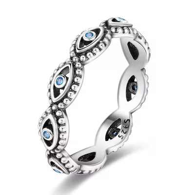 Sterling silver evil eye ring with blue crystal accents and beaded detailing