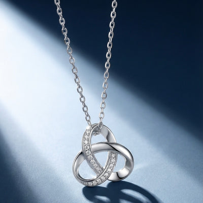 Silver Celtic inspired knot necklace with crystal accents on delicate chain