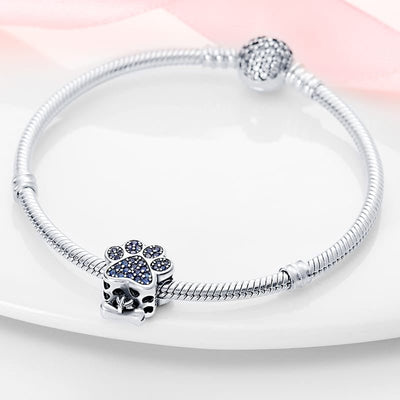 Paw Print Charm with Blue Cubic Zirconia and Bone Dangle - bellissi