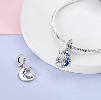 Sisters Friends On A Swing Luminous Moon Charm - bellissi