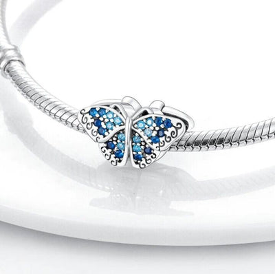 Sparkling Blue Zircon Butterfly Charm - bellissi
