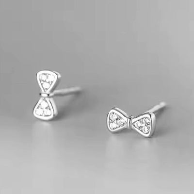 Sparkling Zirconia Bow Stud Earrings - bellissi