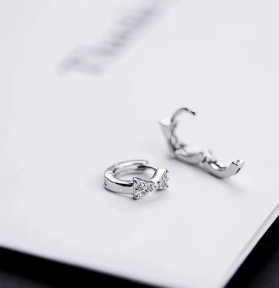 Sterling Silver Bow Huggie Earrings with Cubic Zirconia - bellissi