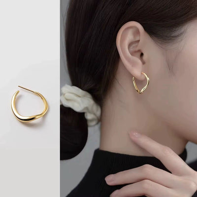 modern Waveform earrings — sleek silver curved earrings inspired by sound waves